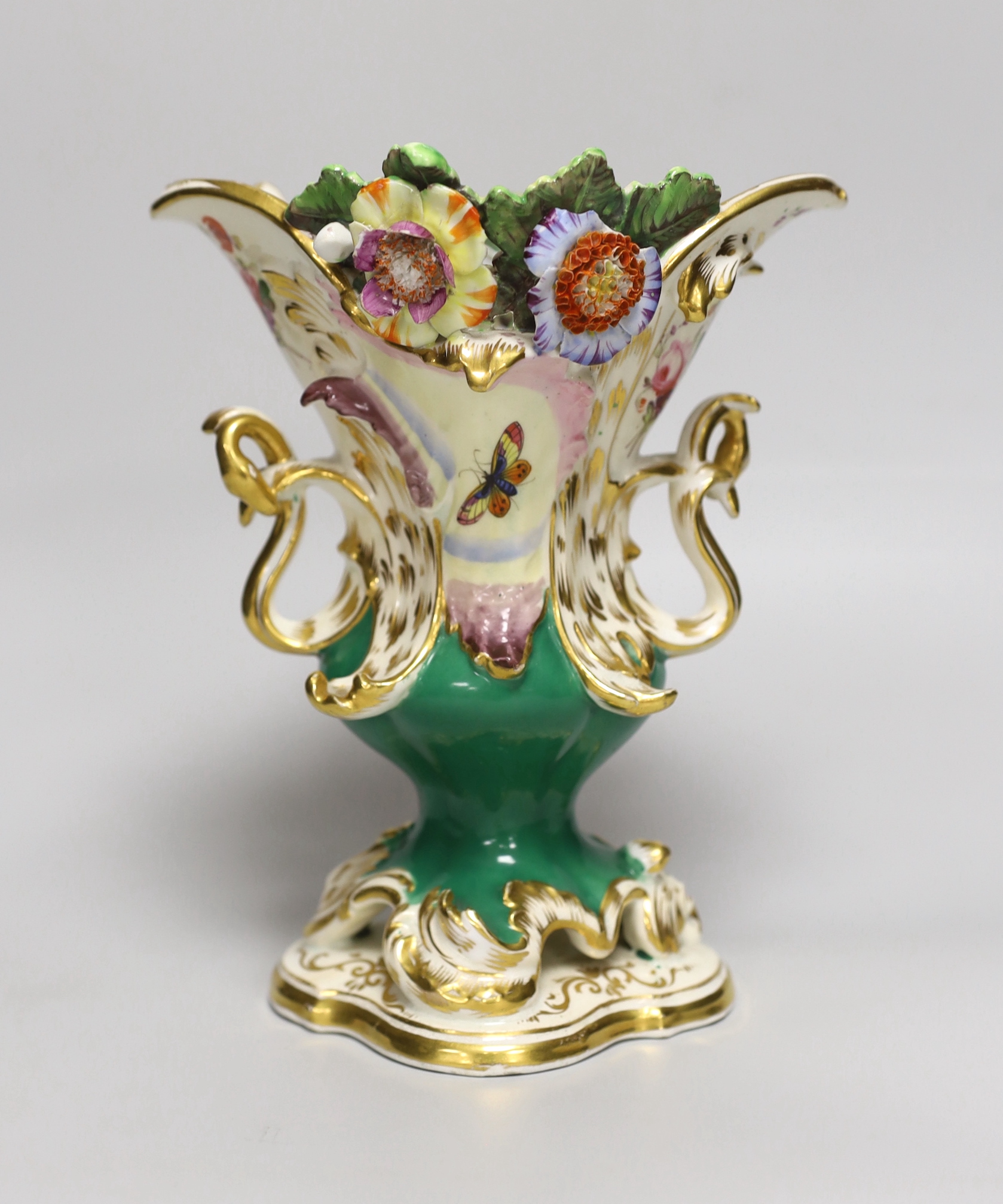 A 19th century Coalport two handled floral encrusted vase painted with flowers and a green ground, CD mark for Coalbrookdale, 21cm high